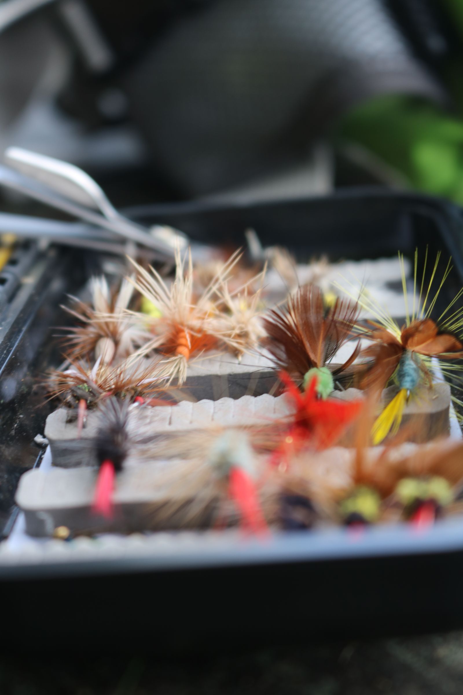 A close-up of hand-tied trout flies